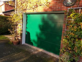 Carteck Solid Smooth insulated sectional garage door in Moss Green